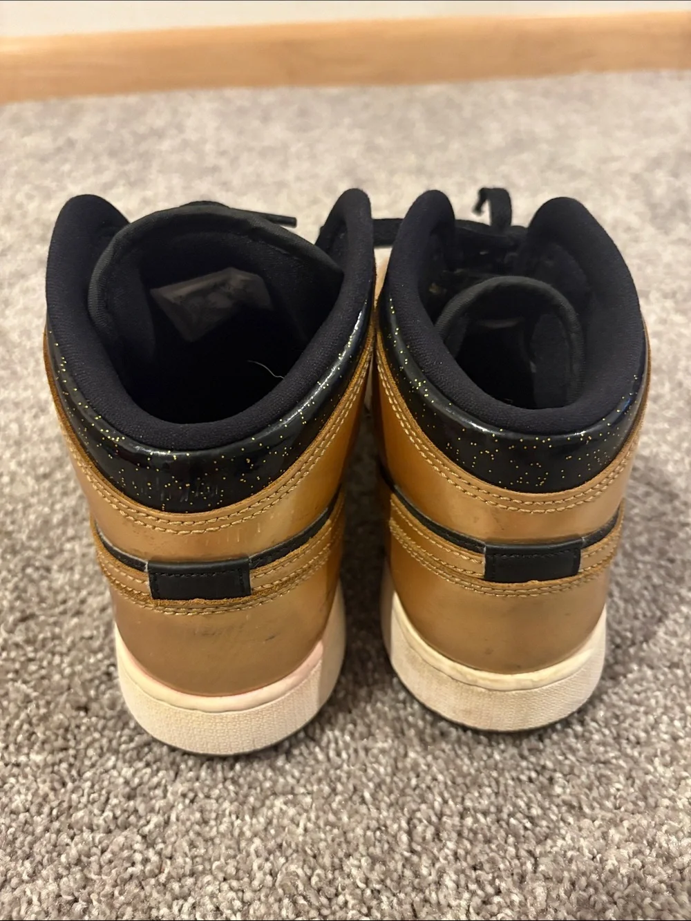 Nike Mid-Top Sneakers in Black and Gold